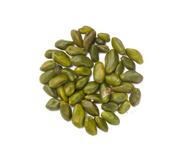 green pistachios on a white background