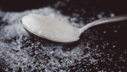 Sugar Spoon on Black Background