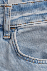 Details of used jeans. Pocket of light blue men's pants
