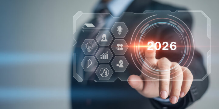 Businessman touching a futuristic interface with 2026 representing technology and innovation for business planning and strategy