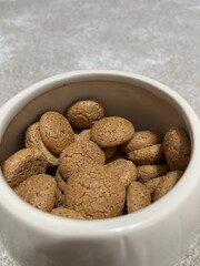 Traditional Dutch Pepernoten Cookies in a White Bowl