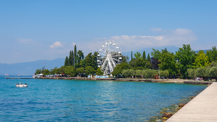 view of the waterfront of Bardolino, a popular town on the eastern shore of Lake Garda in Italy