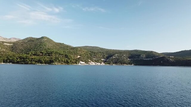 Drone flying low above Slano bay, Croatia