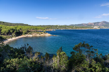 Fototapeta premium Elba Island Coastal View Over Dark Blue Sea - Scenic Seaside Landscape, Rugged Cliffs, Mediterranean Colors, Sunset Mood