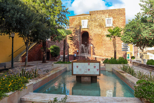 View of the old town of Silves with historic buildings, the old cathedral and the Castelo de Silves, Portimao region, Algarve Portugal