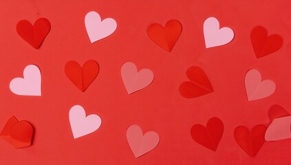 Abstract Arrangement of Heart Shapes on a Flat Red Surface, a Visual Pattern.