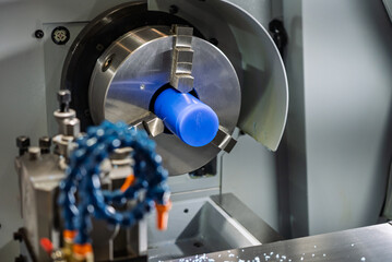Fototapeta premium Cnc machine. The CNC lathe machine or Turning machine. Turning numerical control machine with tools and chuck. Inside view of a cnc machine. CNC lathe interior