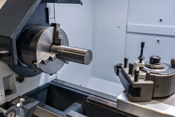 Cnc machine. The CNC lathe machine or Turning machine. Turning numerical control machine with tools and chuck. Inside view of a cnc machine. CNC lathe interior