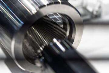 Obraz premium Thread finishing on a CNC machine. Thread burnishing machine, internal thread finishing