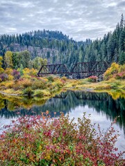  Bridge spans on river in autumn.