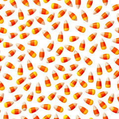 Assortment of candies in orange, yellow and white against a black backdrop