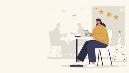 Woman working on a tablet in a cozy winter cafe decorated for the holidays Remote work lifestyle