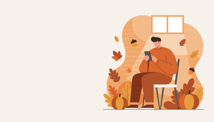 Cozy man in autumn scene using smartphonetablet surrounded by fall leaves and pumpkins