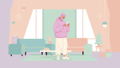 Stylish senior man texting on phone in modern pastel living room decorated for winter holidays