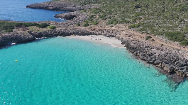 Aerial View Crystal Clear Turquoise Waters, Sea Caves, and Natural Arch of Cala Varques, Mallorca