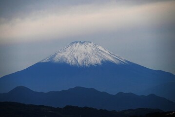 Fototapeta premium A view of Mount Fuji in late autumn. Snow suits Mount Fuji well, but rising temperatures in recent years have delayed the first snowfall, and in 2025 it was October 23rd.