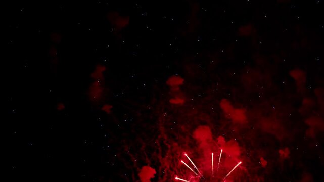 sky spectacle unfurls, celestial fireworks paint heavens beautifully, colorful explosions mimic cosmic phenomena in night sky, vivid pyrotechnics emulate nebulae and star formations across midnight