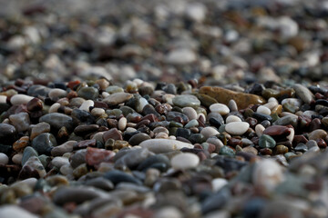 Colorful pebble stones on the beach, pebbles on the beach of Antalya, close-up, background