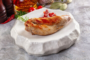 Roasted rabbit leg served rosemary