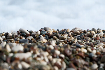 Colorful pebble stones on the beach, pebbles on the beach of Antalya, close-up, background