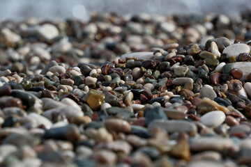 Colorful pebble stones on the beach, pebbles on the beach of Antalya, close-up, background