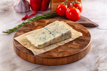 Tasty Italian gorgonzola cheese over board