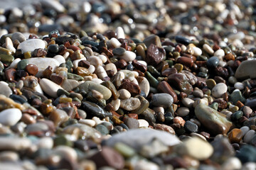 Colorful pebble stones on the beach, pebbles on the beach of Antalya, close-up, background