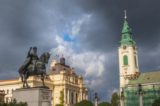 Church, town hall and Ferdinand I statue in Oradea town - Romania