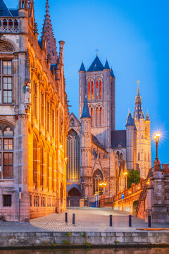 Ghent, Belgium. Graslei Channel at twilight, Sint-Niklaaskerk church