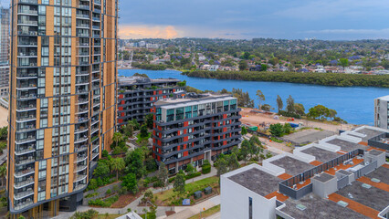 Aerial Drone View of Wentworth Point and Rhodes a suburb in western Sydney newly built residential high rise apartments area on Parramatta River Sydney NSW Australia