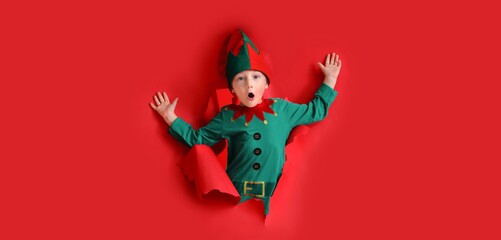 Shocked little elf on red background