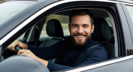 Happy man driving a car with a big smile on his face.