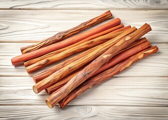 Aromatic cedar wood sticks laid on a white wooden table