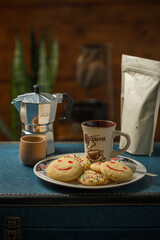 Woman drinking coffee with cookies in a porcelain glass and saucer. Mujer tomando café con galletas en vaso y plato de porcelana.