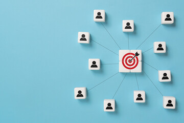 Customer relationship management concept. Dice with target icon linked with human icons for customer focus group. Data exchanges development and customer service