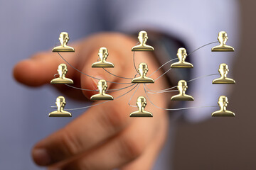 Hand touching network of people, representing connection, communication, teamwork, and business networking in a corporate or global context. Ill