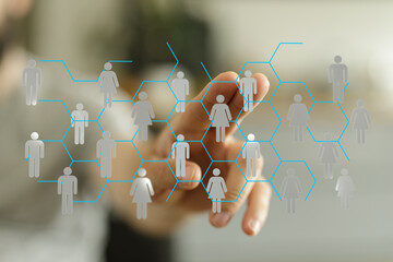 Hand touching digital interface displaying human network. Concept of social connection, networking, global communication and people.