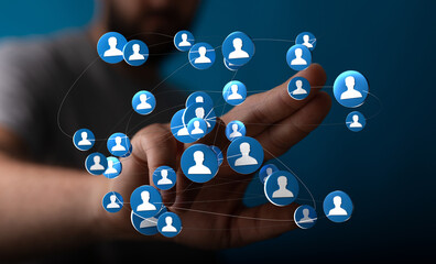 Hand interacting with a network of digital people icons, symbolizing social connections, community, and communication.