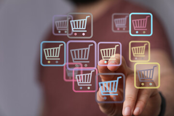 Hand interacting with virtual shopping cart symbols, representing online retail, e-commerce, and digital buying. Perfect for business and techno