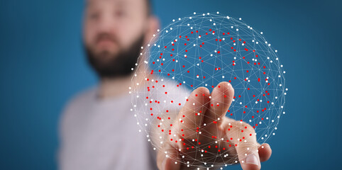A close-up of a hand touching a network of points, symbolizing connection and technology. The...