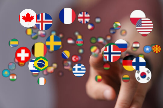 Conceptual image of hand reaching for flags representing international relations and global community. Symbol of global cooperation and peace. P