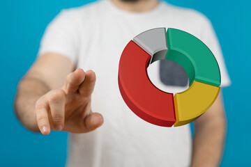 Close up shot of a man pointing at a 3D rendered pie chart representing financial data, business strategy or market analysis on a blue backgroun