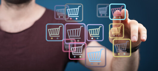 Person interacting with virtual shopping carts, indicating online purchase and digital commerce, e-business, and consumerism.