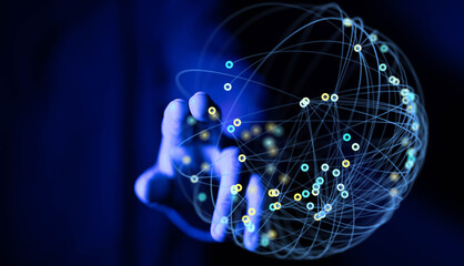 Abstract image of a hand interacting with a glowing network globe, representing global...