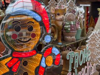 Festive gingerbread man light display with reindeer and gingerbread man ornaments. Perfect for holiday marketing and Christmas themes.