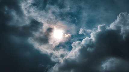 Fototapeta premium Brilliant light source shines intensely through dense, dramatic overcast formations in the sky