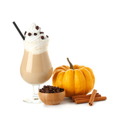 Glass of hot pumpkin latte with whipped cream, coffee beans and cinnamon on white background