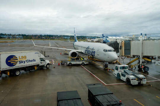 portland, oregon, usa - october 25, 2025: an alaska airlines  parked at a gate at portland international airport