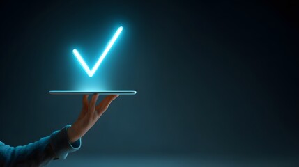 Human hand presents glowing neon check mark symbol emerging from a digital tablet