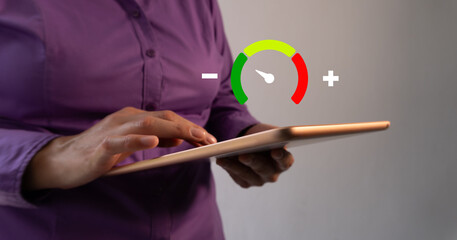 A woman with a tablet, and a low-risk icon.